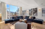 Experience luxury living in this stunning property, featuring a spacious living room with breathtaking mountain views.