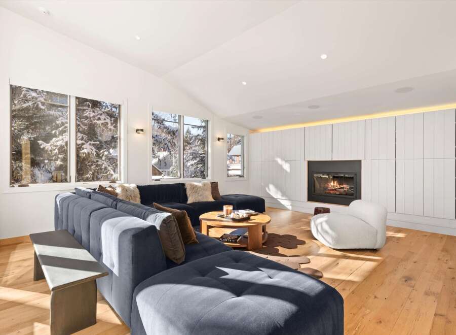 Experience luxury living in this stunning property, featuring a cozy fireplace and a modern, open-concept design.