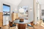 This stunning dining room showcases a modern design with a touch of nature.