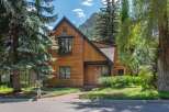 Experience modern mountain living in this stunning wood-clad home, nestled against a backdrop of majestic peaks.