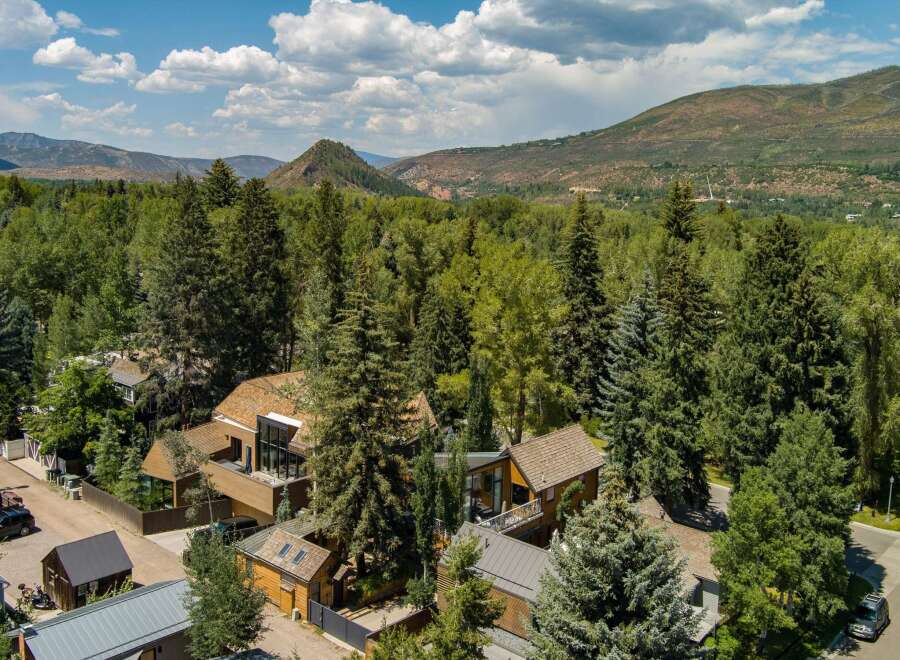 Nestled amidst lush greenery and majestic mountains, this property offers a serene retreat with modern architectural design.