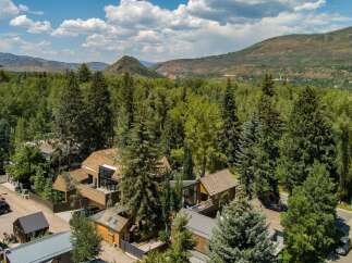 Nestled amidst lush greenery and majestic mountains, this property offers a serene retreat with modern architectural design.