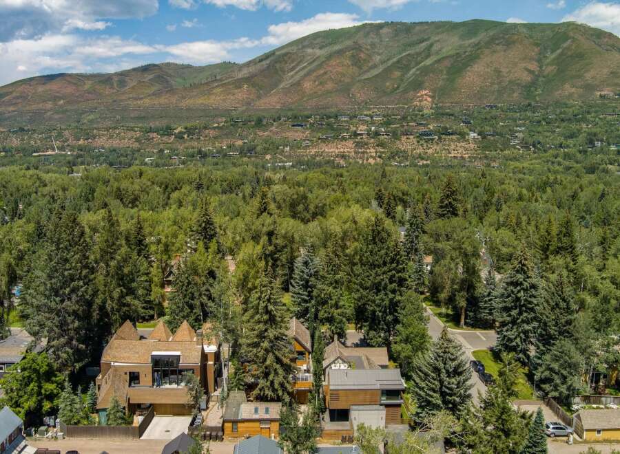 Nestled amidst a lush forest, this property offers a serene escape with stunning mountain views.