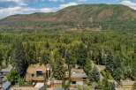 Nestled amidst a lush forest, this property offers a serene escape with stunning mountain views.