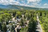 Nestled amidst lush greenery and mature trees, this property offers a serene mountain town escape.