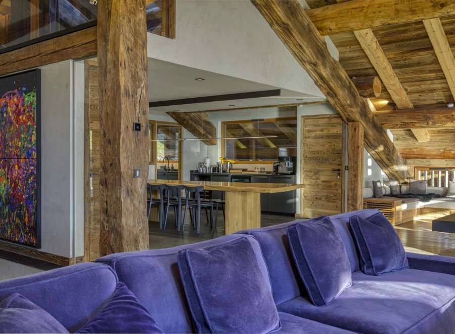Experience luxury living in this stunning property featuring exposed wooden beams and a modern kitchen.