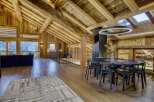 Experience luxury living in this stunning chalet, featuring a unique wooden interior and breathtaking views.
