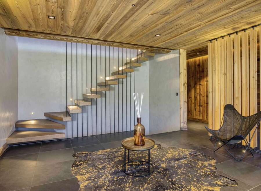 This stunning property boasts a modern interior design with a focus on natural materials.