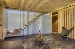 This stunning property boasts a modern interior design with a focus on natural materials.