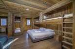 Step into rustic luxury with this stunning wooden bedroom.
