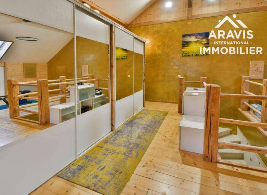 Discover this stunning property featuring a unique design with wooden accents and a modern touch.