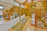 Discover this stunning property featuring a unique design with wooden accents and a modern touch.