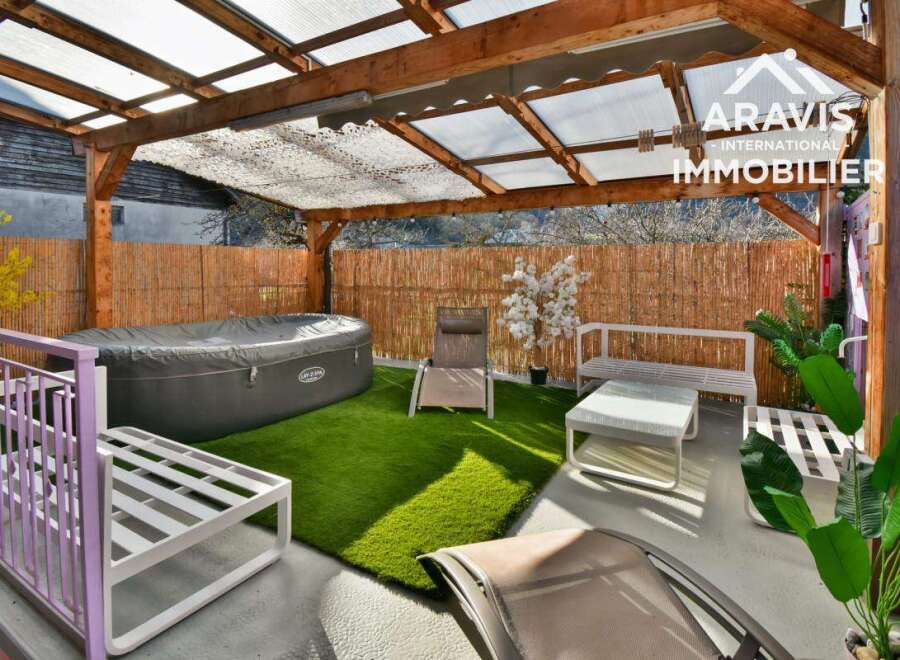 Discover your own private oasis with this stunning property! Featuring a luxurious hot tub, comfortable seating areas, and lush greenery, this space is perfect for relaxation and entertaining.