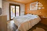 Discover a cozy bedroom retreat with natural wood accents and a serene ambiance.