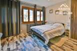 Discover a cozy bedroom with a warm and inviting atmosphere.