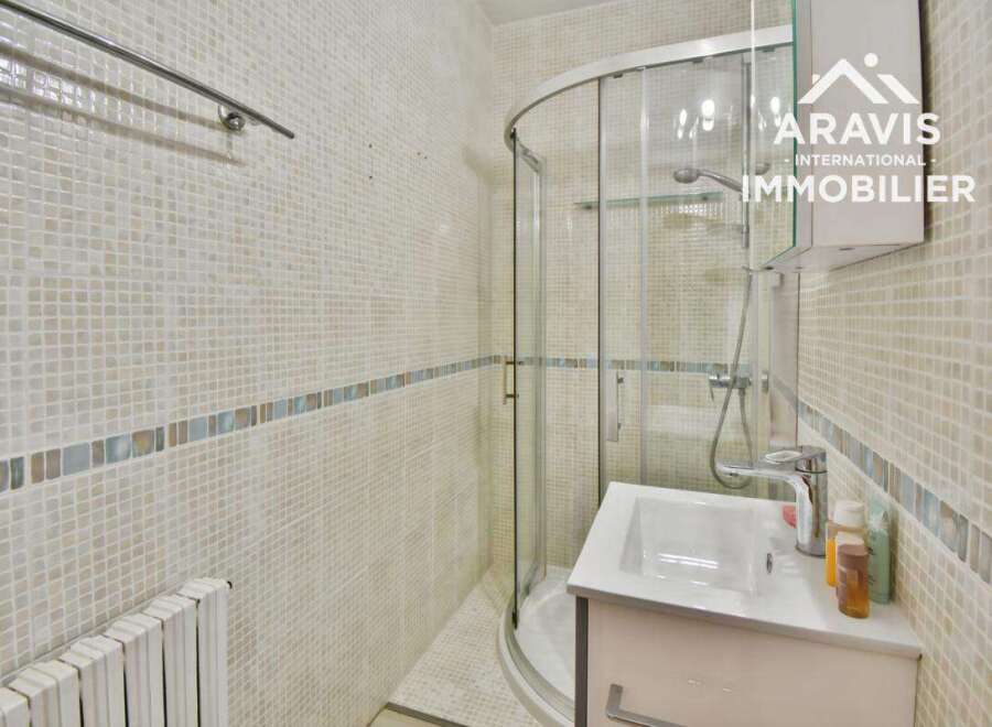 Discover this charming bathroom featuring a modern shower and a sleek vanity.