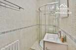 Discover this charming bathroom featuring a modern shower and a sleek vanity.