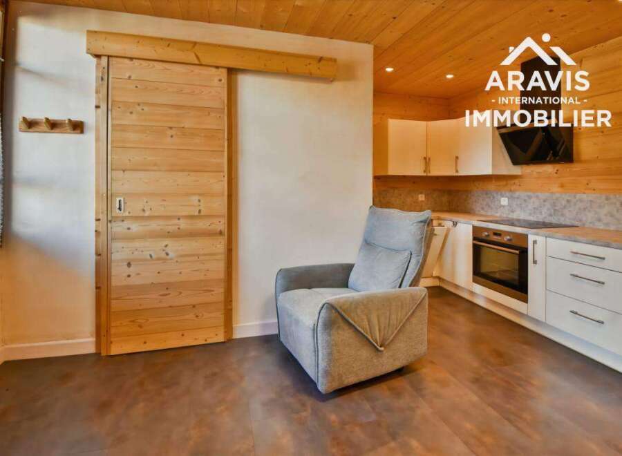 Discover this stunning property featuring a modern kitchen and a cozy living area.