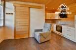 Discover this stunning property featuring a modern kitchen and a cozy living area.