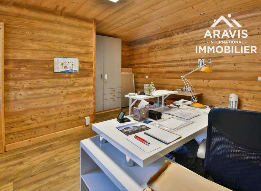 This stunning office space boasts a warm and inviting atmosphere, perfect for productivity and creativity.