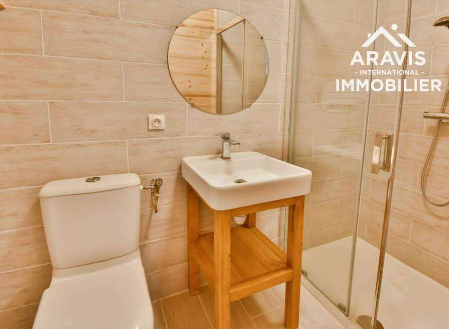 Discover this charming bathroom featuring a modern sink and a convenient toilet.