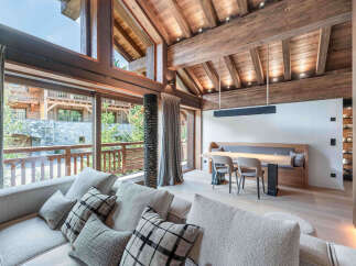 Experience luxury living in this stunning property featuring a spacious living area with a cozy sofa and stylish pillows.