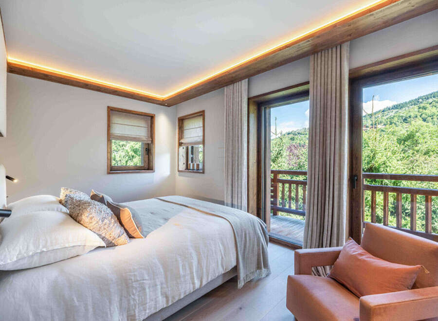 Experience the tranquility of this stunning bedroom, featuring a seamless blend of modern design and natural elements.