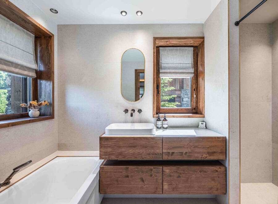 This stunning bathroom boasts a modern design with a touch of rustic charm.
