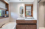 This stunning bathroom boasts a modern design with a touch of rustic charm.