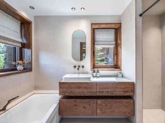 This stunning bathroom boasts a modern design with a touch of rustic charm.