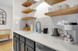 This stunning kitchen boasts modern design elements and high-end finishes.