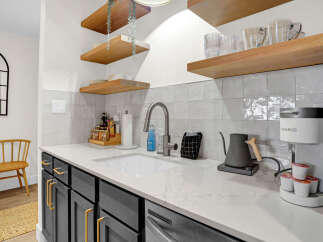 This stunning kitchen boasts modern design elements and high-end finishes.