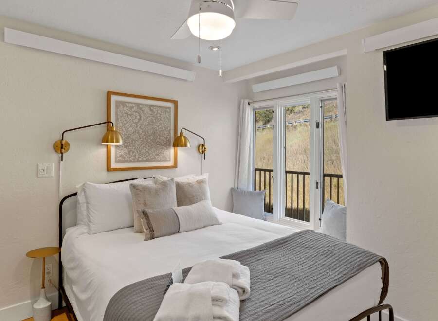 Experience comfort and style in this beautifully designed bedroom.