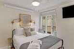 Experience comfort and style in this beautifully designed bedroom.