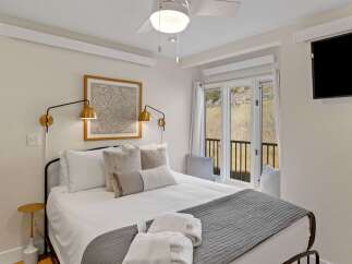 Experience comfort and style in this beautifully designed bedroom.