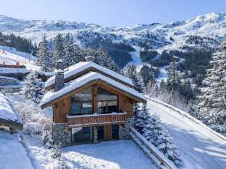 Experience the ultimate winter escape in this stunning chalet nestled in the heart of the mountains.
