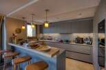 Step into a modern kitchen designed for both style and functionality.