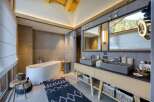 This luxurious bathroom boasts a modern design with high-end finishes.