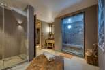 Indulge in luxury and relaxation in this stunning spa-like bathroom.