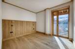 This stunning room boasts a warm and inviting atmosphere with its natural wood accents and flooring.