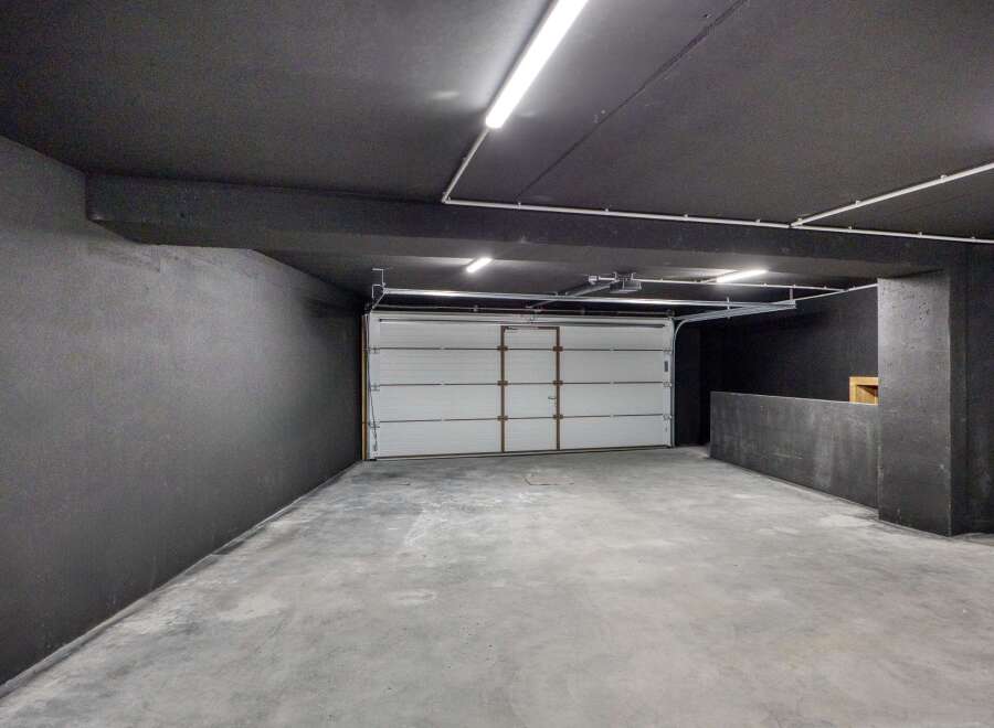 Discover the potential of this spacious garage, perfect for storage or a workshop.