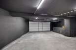 Discover the potential of this spacious garage, perfect for storage or a workshop.