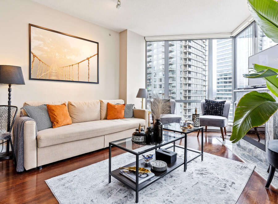 Experience luxury living in this stunning condo! This property boasts a spacious living area, perfect for entertaining or relaxing.