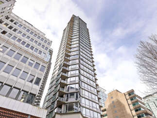 This stunning high-rise building offers a modern and luxurious living experience.