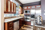 This stunning kitchen boasts modern appliances and elegant cabinetry, perfect for culinary enthusiasts.