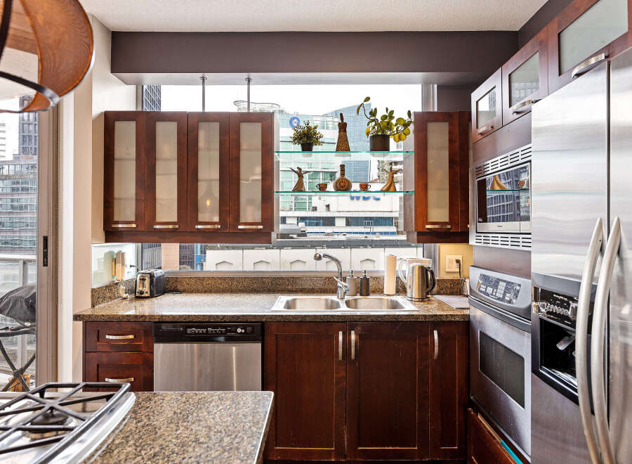 This stunning kitchen boasts modern appliances and elegant cabinetry, perfect for culinary enthusiasts.