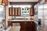 This stunning kitchen boasts modern appliances and elegant cabinetry, perfect for culinary enthusiasts.