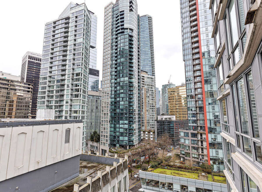 Explore the stunning architecture of this urban oasis, featuring modern high-rise buildings with sleek glass facades.
