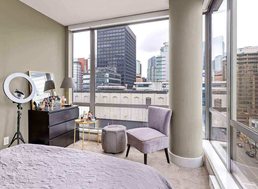 This stunning urban apartment boasts breathtaking city views from expansive windows.
