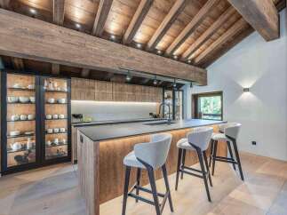 This stunning kitchen showcases a blend of rustic charm and modern design.